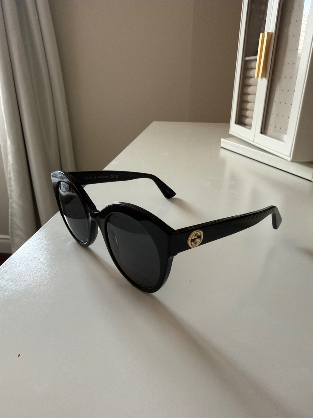 Gucci Black Round Sunglasses with Gold GG Accent